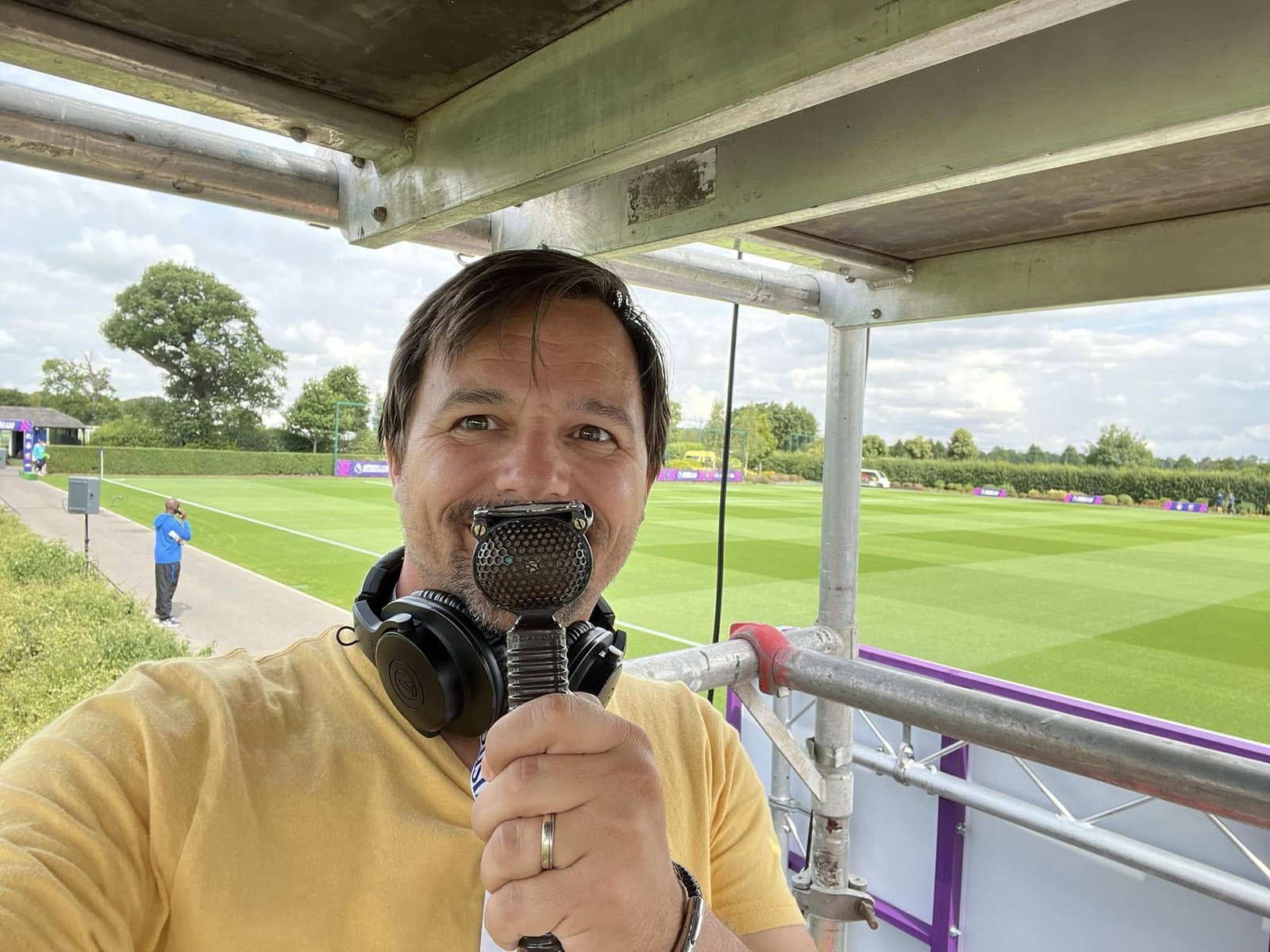 Dean Kilford commentating pitch-side at a Premier League NextGen fixture