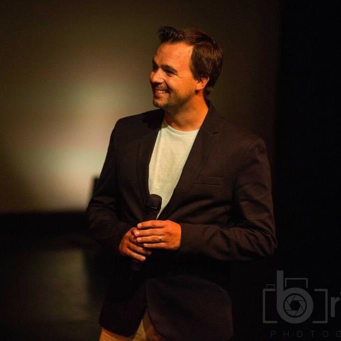 Dean Kilford compering on stage