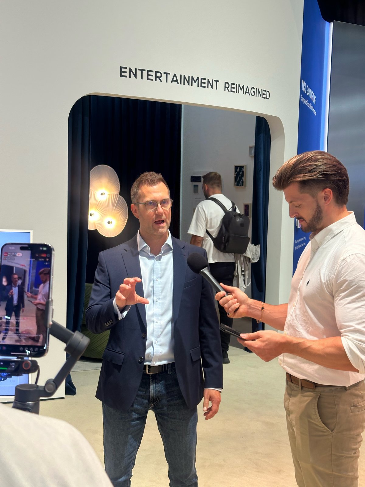 Edd Charlton interviewing a guest on the show floor at IFA