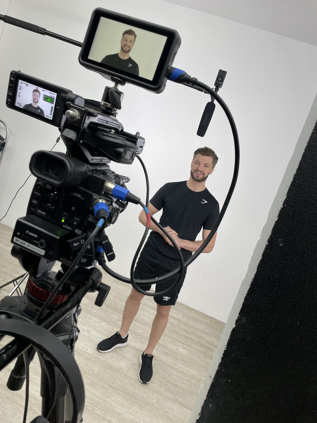 Edd Charlton on set behind the camera monitor