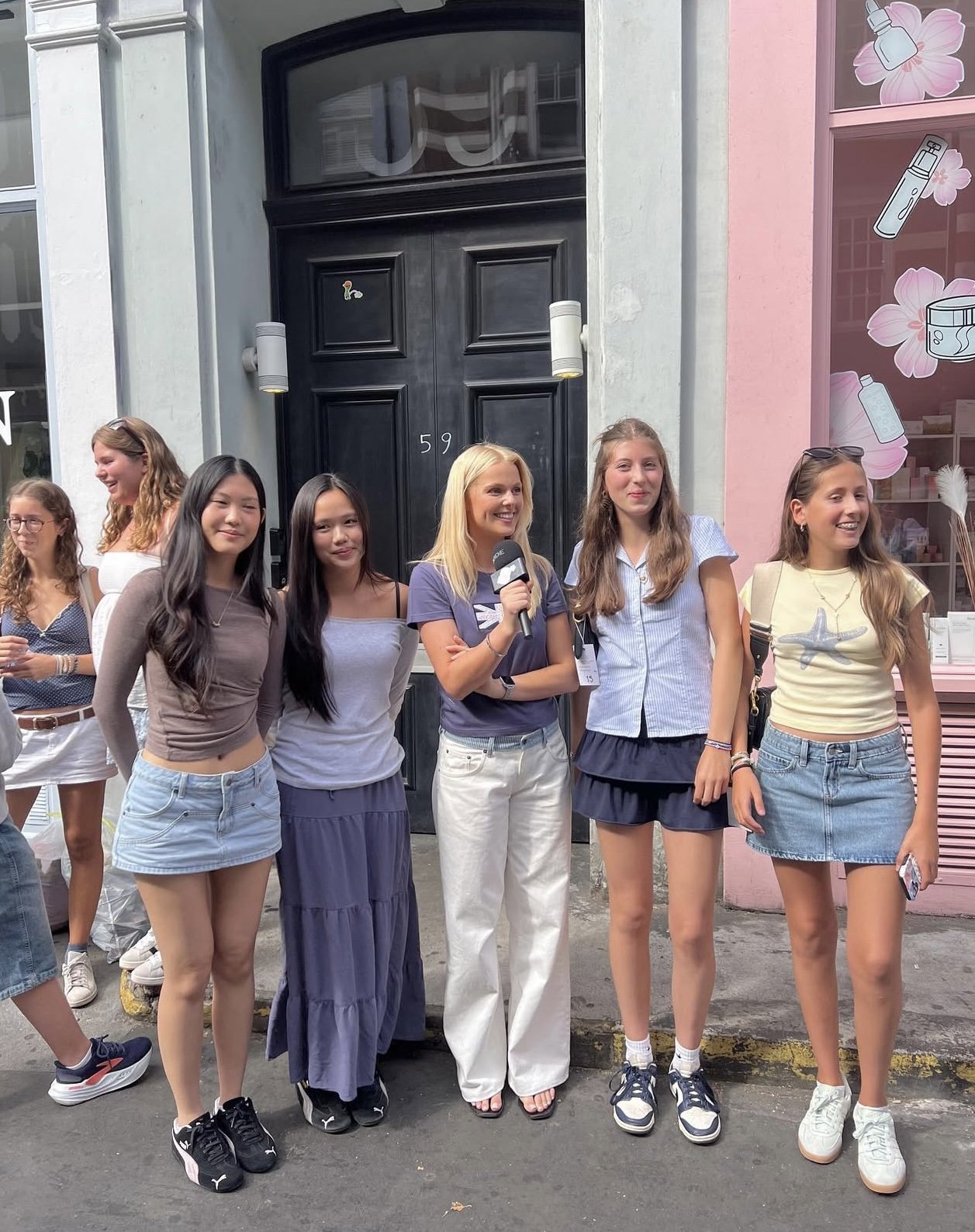 Hannah White filming a vox pop interview on the street