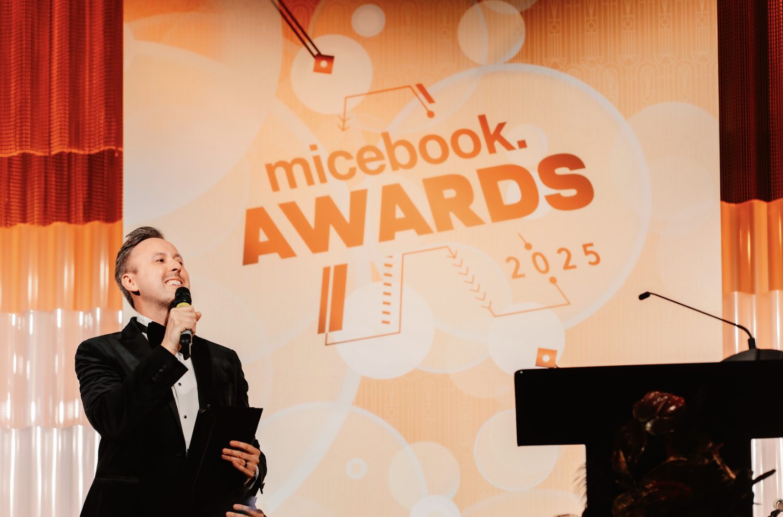 Jamie Body hosting on stage at the Micebook Awards