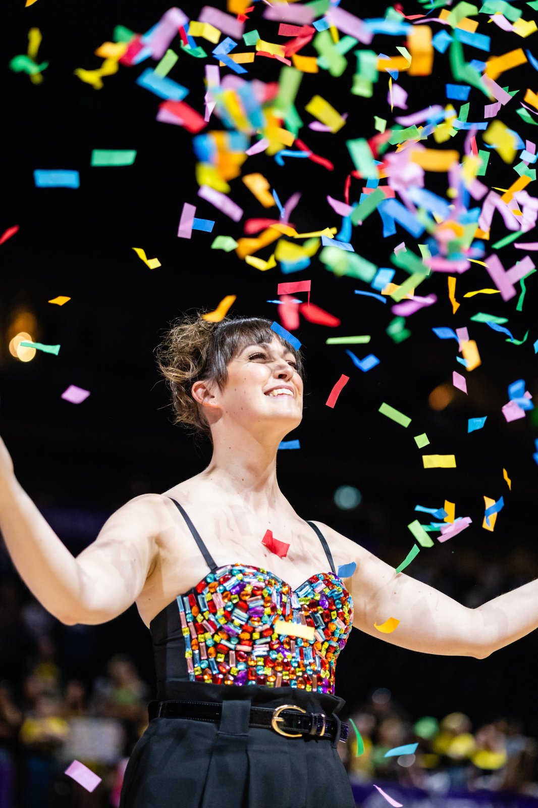Lucy Goodman celebrating on stage with confetti