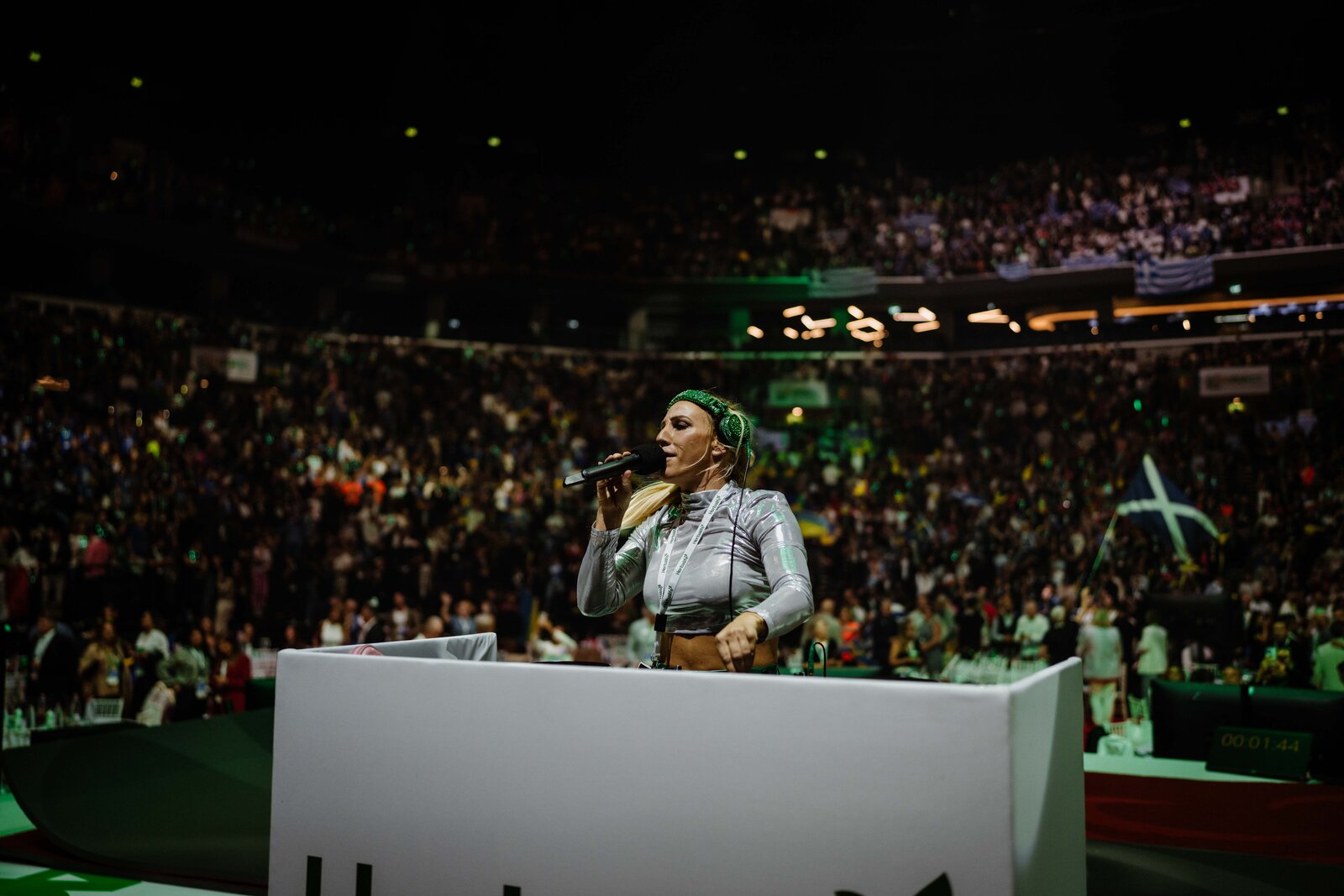 Sarah Giggle DJing on stage to a full arena crowd