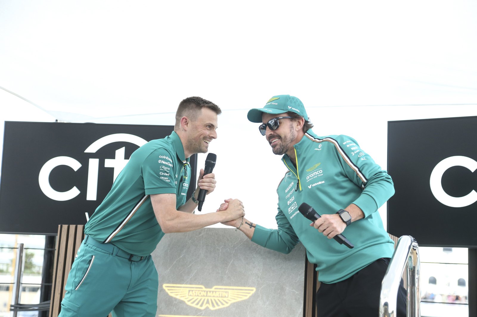 Tom Millen greeting Fernando Alonso on stage