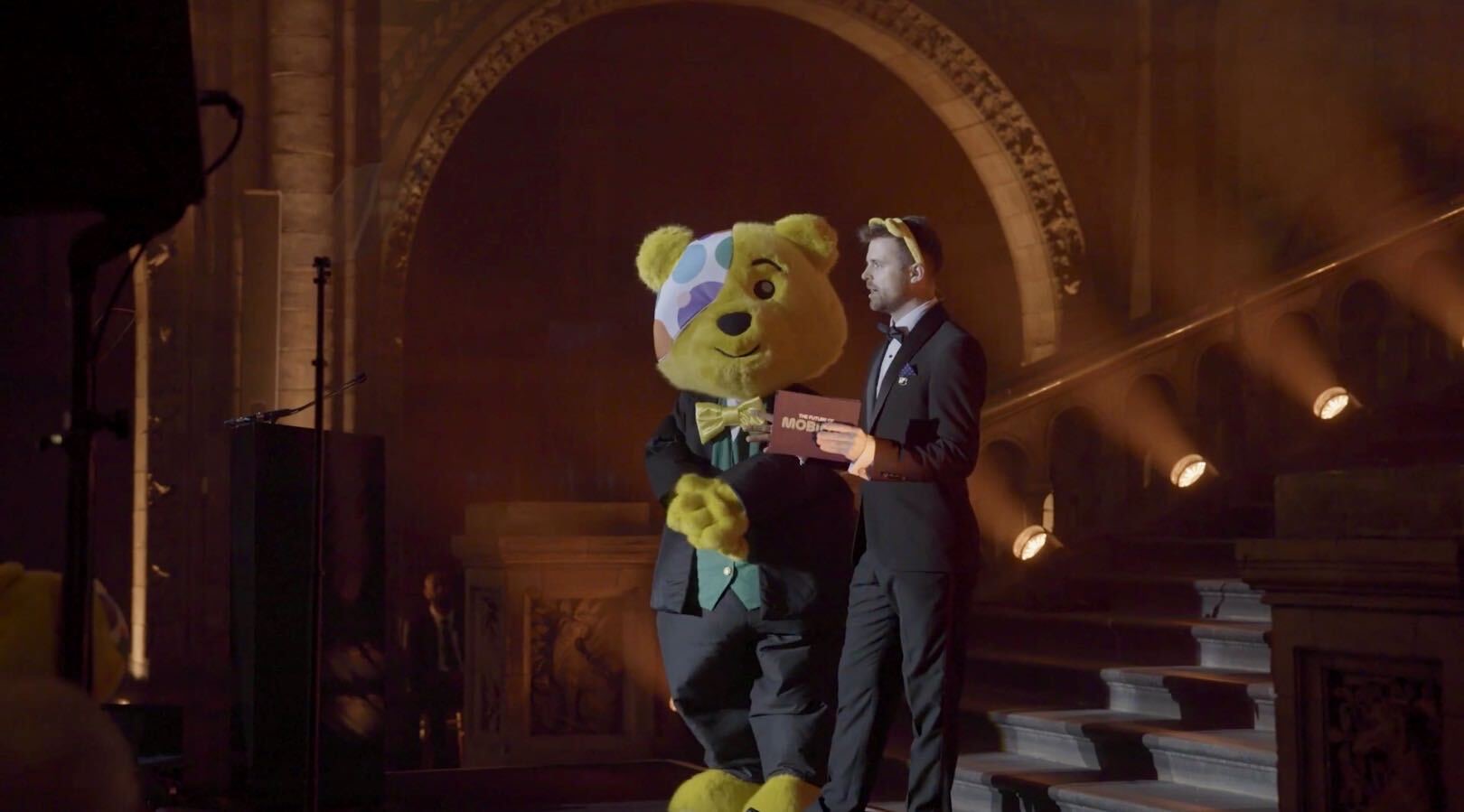 Rob Thornton on stage with Pudsey Bear at the BBC Children in Need gala
