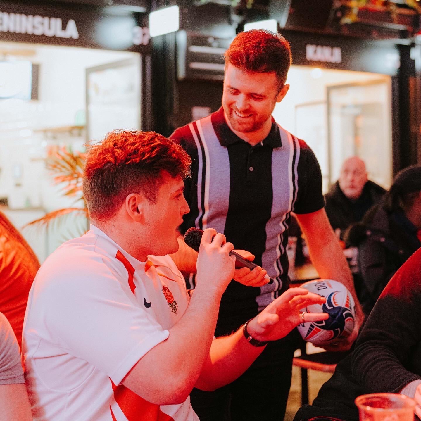 Rob Thornton with an England rugby fan holding a signed ball
